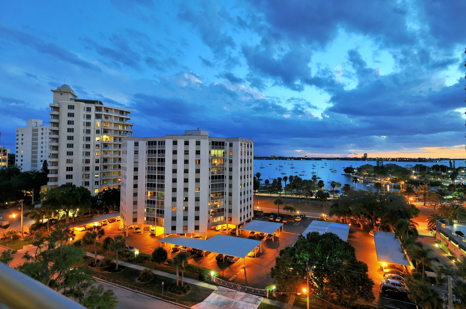 Modern condominium building with large glass windows, representing secure and reliable condo insurance coverage